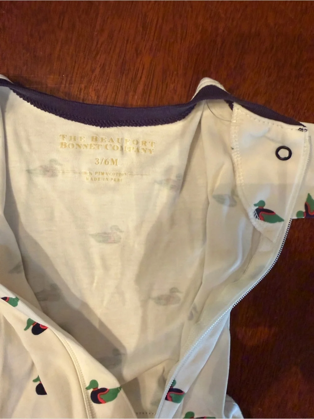 The Beaufort Bonnet Company Cream Footed One-Piece with Duck Print and Navy Trim